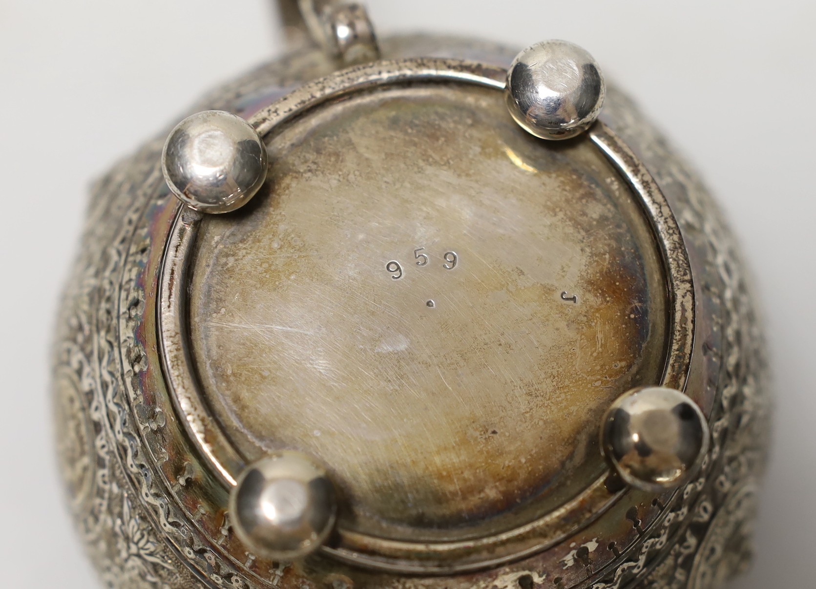 A late Victorian embossed silver cream jug, by Walter & John Barnard, London, 1893, height 74mm, gross weight 5oz.